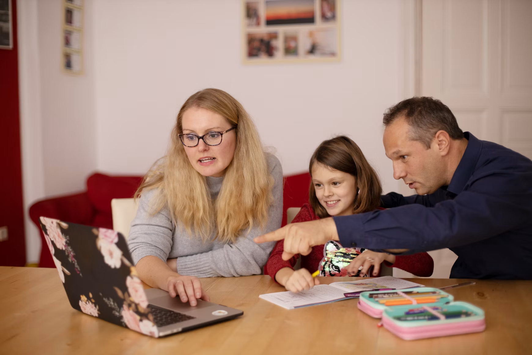 Parents helping their child at home